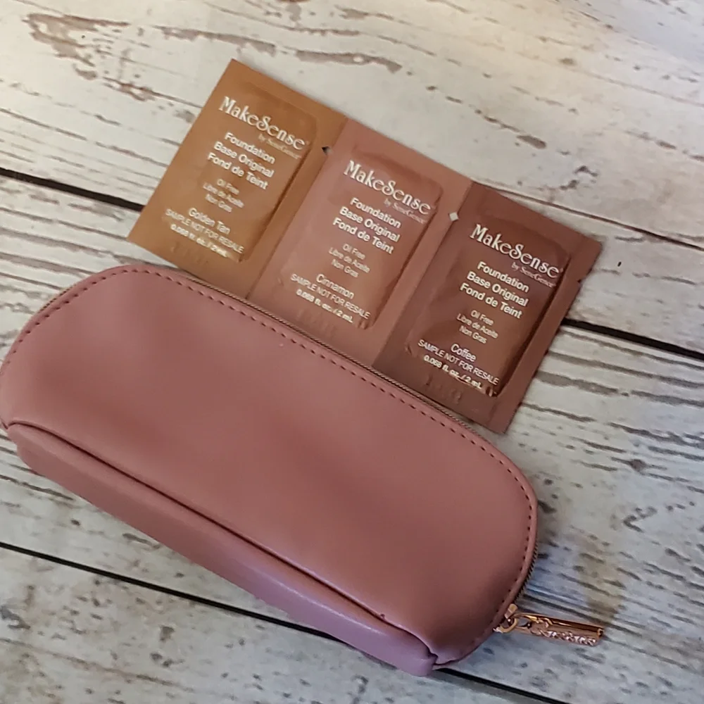 SeneGence pink vinyl makeup bag with foundation samples